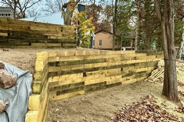 Is treated pine good for retaining wall?