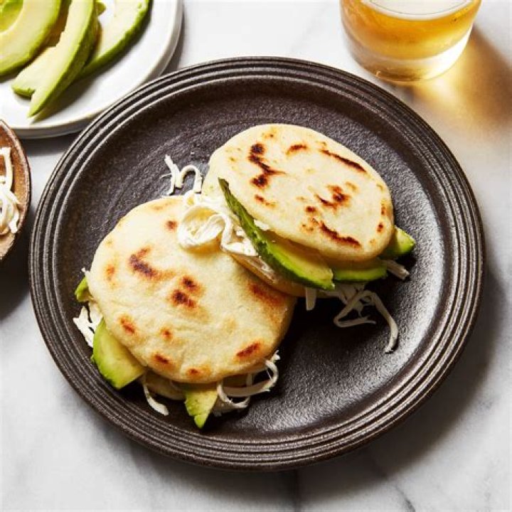 Where are arepas originally from?